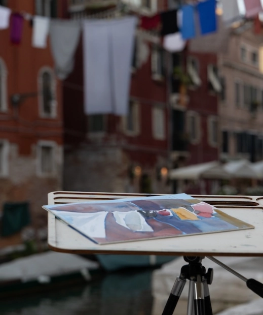 An image of an outdoor painting setup on italian street by making magic